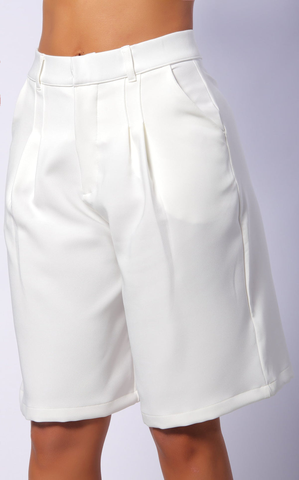Ivory Pleated Tailored Bermuda Shorts by Navissi